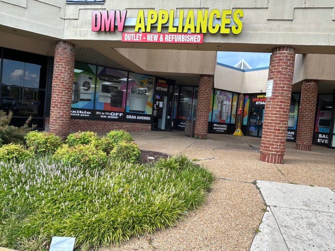 DMV Appliances Outlet storefront at 8794 Sacramento Dr, Alexandria, VA with window graphics of appliances